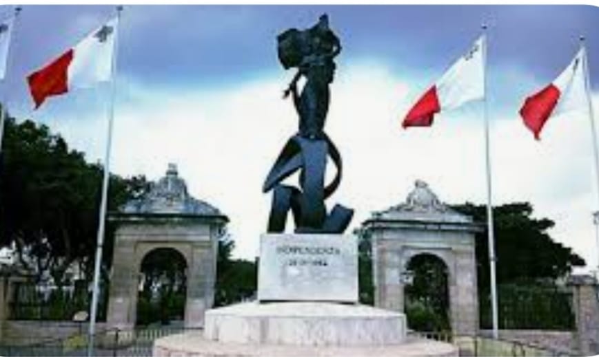 The Independence Monument in Floriana surrounded by Maltese flags